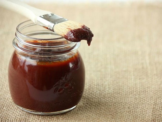 Big League BBQ. BBQ sauce in a jar with a basting brush on it